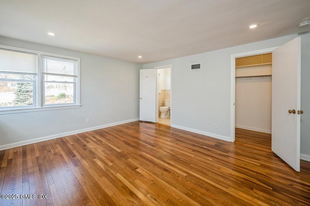19 Bayside Terrace Riverside, CT 06878 - Photo 7 of 26 a view of an empty room with wooden floor and a window