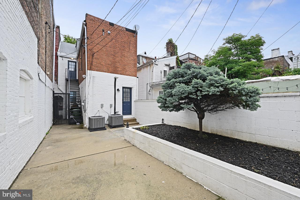 1709 Bank Street Baltimore, MD 21231 - Photo 21 of 49 a view of a house with potted plants