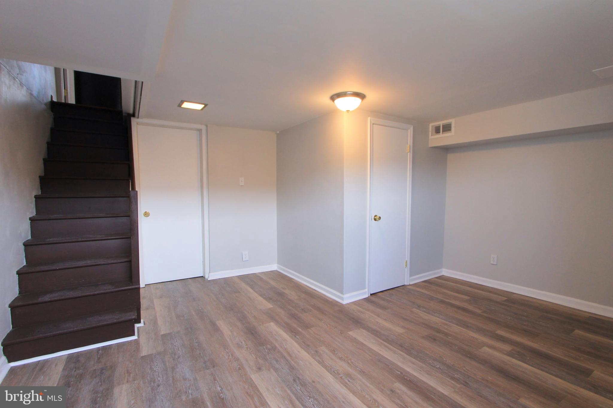 8613 Gilbert Street Philadelphia, PA 19150 - Photo 12 of 28 a view of hallway with stairs and wooden floor
