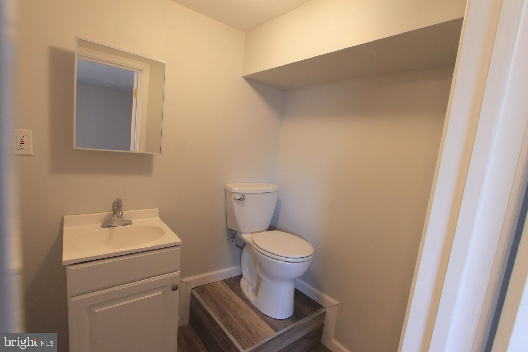 8613 Gilbert Street Philadelphia, PA 19150 - Photo 21 of 28 a bathroom with a toilet and a sink