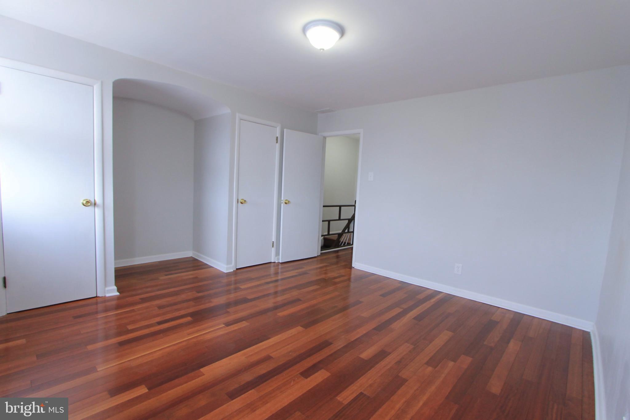 8613 Gilbert Street Philadelphia, PA 19150 - Photo 26 of 28 a view of an empty room and wooden floor