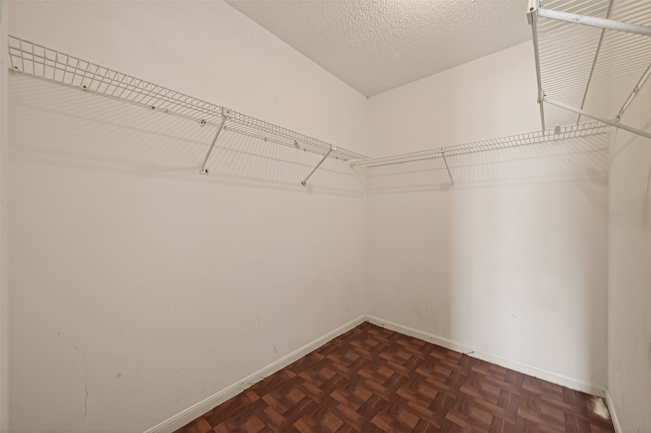 10101 South Gessner Road, Unit 307 Houston, TX 77071 - Photo 11 of 20 a view of a room with racks on the wall