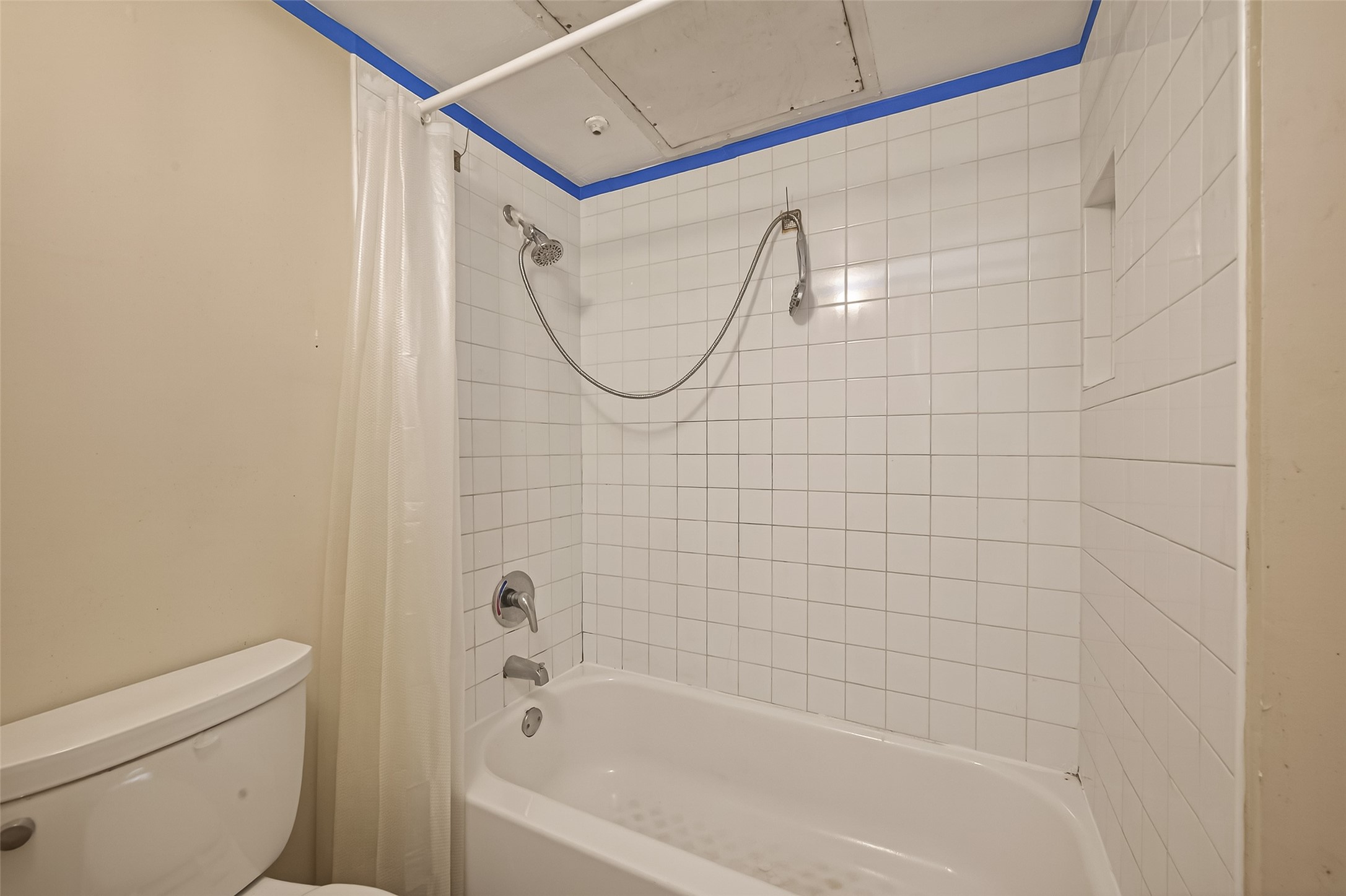 10101 South Gessner Road, Unit 307 Houston, TX 77071 - Photo 12 of 20 a bathroom with a shower and a toilet