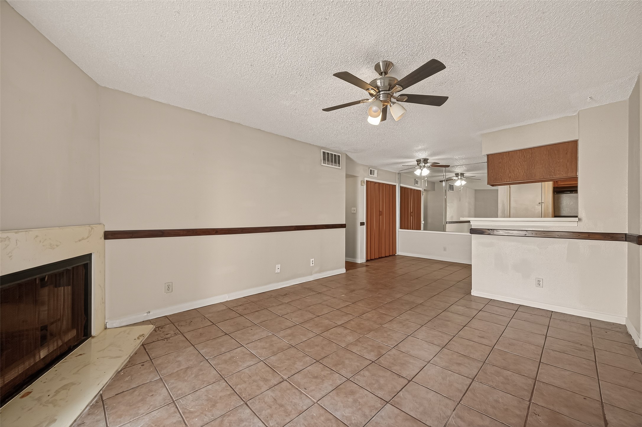 10101 South Gessner Road, Unit 307 Houston, TX 77071 - Photo 13 of 20 a view of a kitchen with a sink and a refrigerator