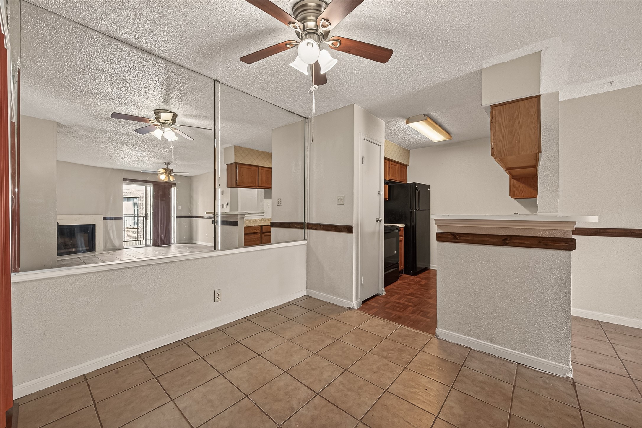 10101 South Gessner Road, Unit 307 Houston, TX 77071 - Photo 15 of 20 a view of a kitchen with a sink and a refrigerator