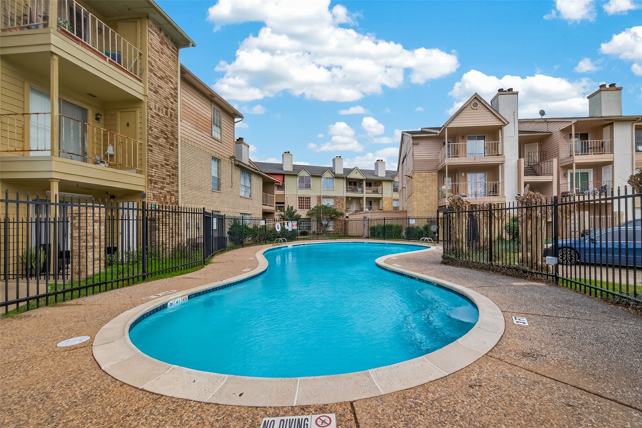 10101 South Gessner Road, Unit 307 Houston, TX 77071 - Photo 20 of 20 a view of a swimming pool with a garden
