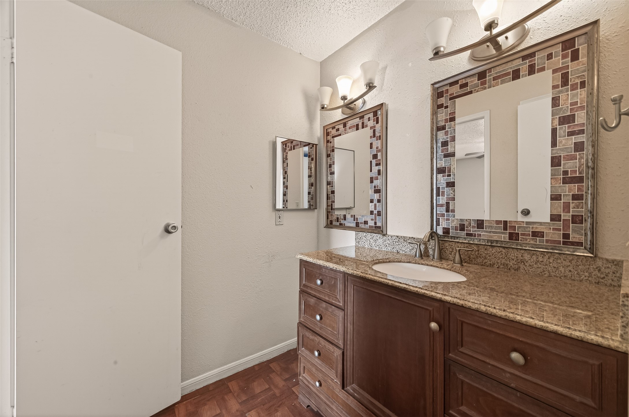 10101 South Gessner Road, Unit 307 Houston, TX 77071 - Photo 8 of 20 a bathroom with a granite countertop sink and a mirror
