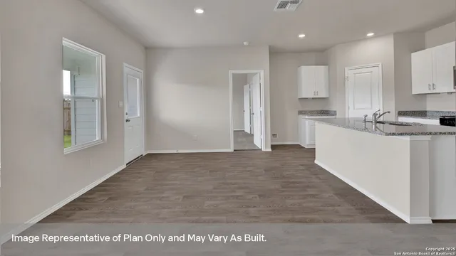 a view of a kitchen with a sink cabinets and window