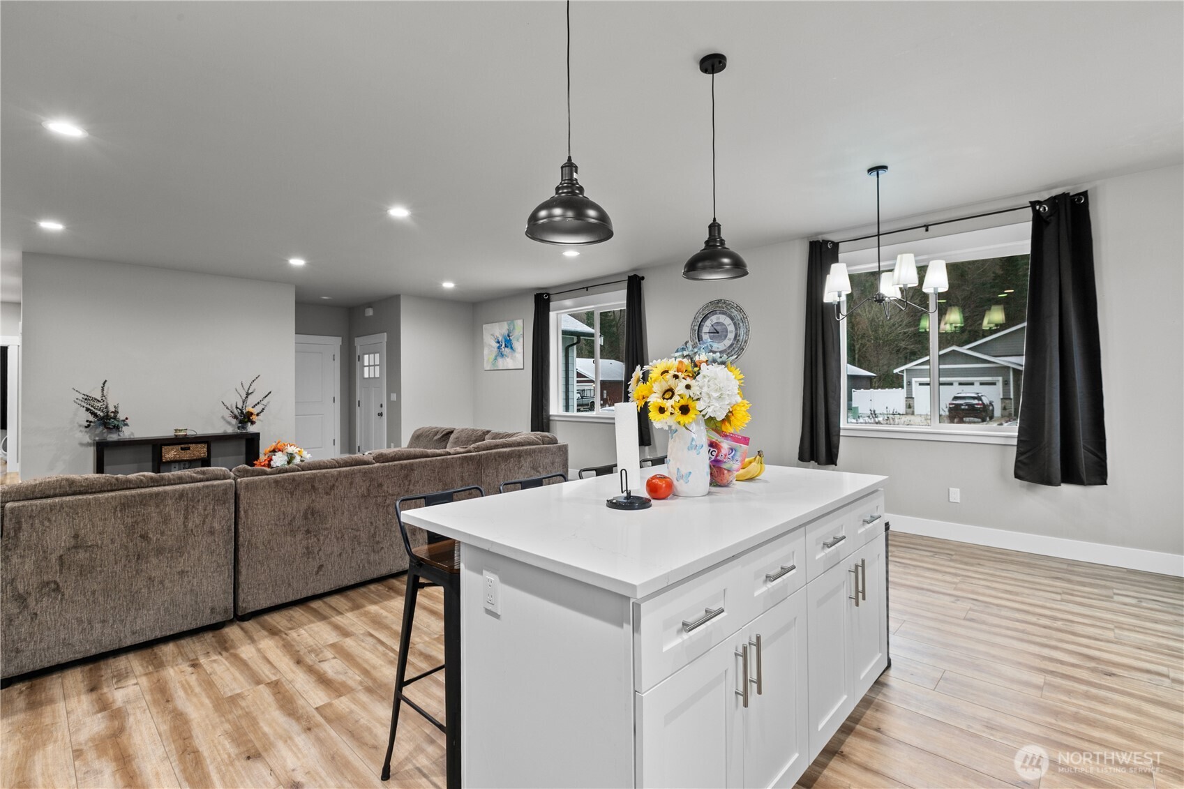 8233 Goldrun Drive Maple Falls, WA 98266 - Photo 11 of 24 a kitchen with a sink a counter top space and living room view
