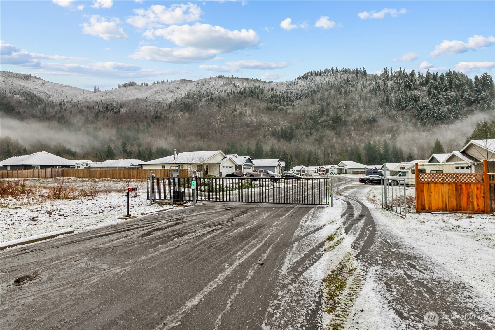 8233 Goldrun Drive Maple Falls, WA 98266 - Photo 2 of 24 a view of a town with swimming pool and mountains