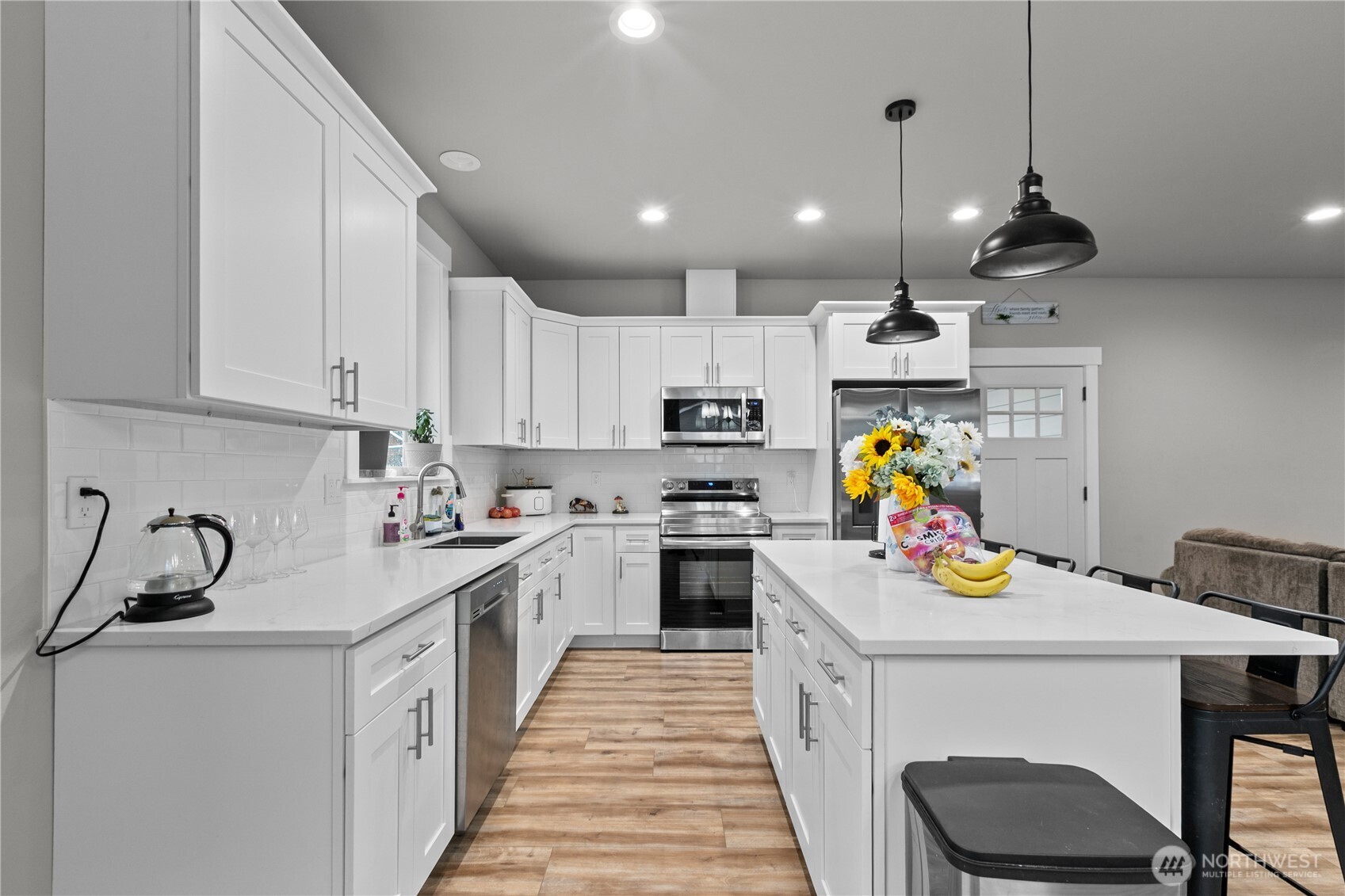 8233 Goldrun Drive Maple Falls, WA 98266 - Photo 10 of 24 a kitchen that has a lot of cabinets in it and appliances