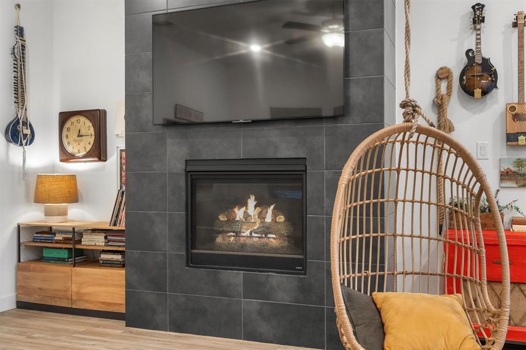 813 Forest Lake Road Flower Mound, TX 75028 - Photo 13 of 39 a view of a livingroom with furniture and a fireplace
