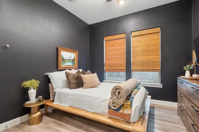 a bedroom with furniture and a window