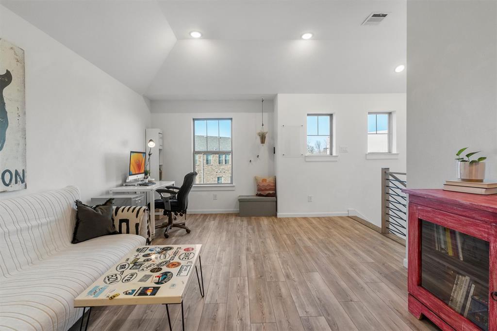 813 Forest Lake Road Flower Mound, TX 75028 - Photo 18 of 39 a bedroom with furniture and a wooden floor