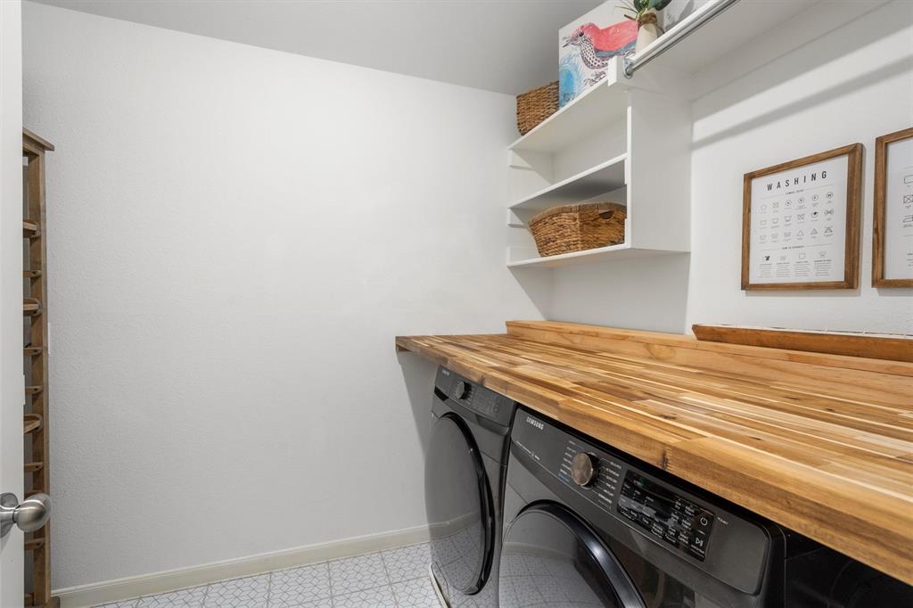 813 Forest Lake Road Flower Mound, TX 75028 - Photo 27 of 39 a bedroom with a bed and cabinets