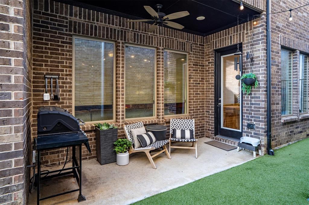 813 Forest Lake Road Flower Mound, TX 75028 - Photo 28 of 39 a view of a patio with a table and chairs and potted plants
