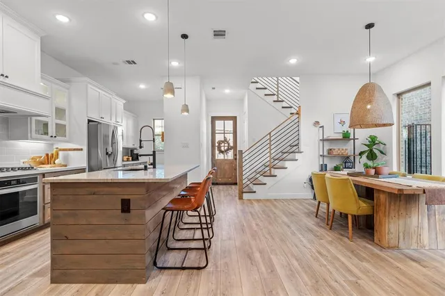 a view of kitchen with furniture and wooden floor