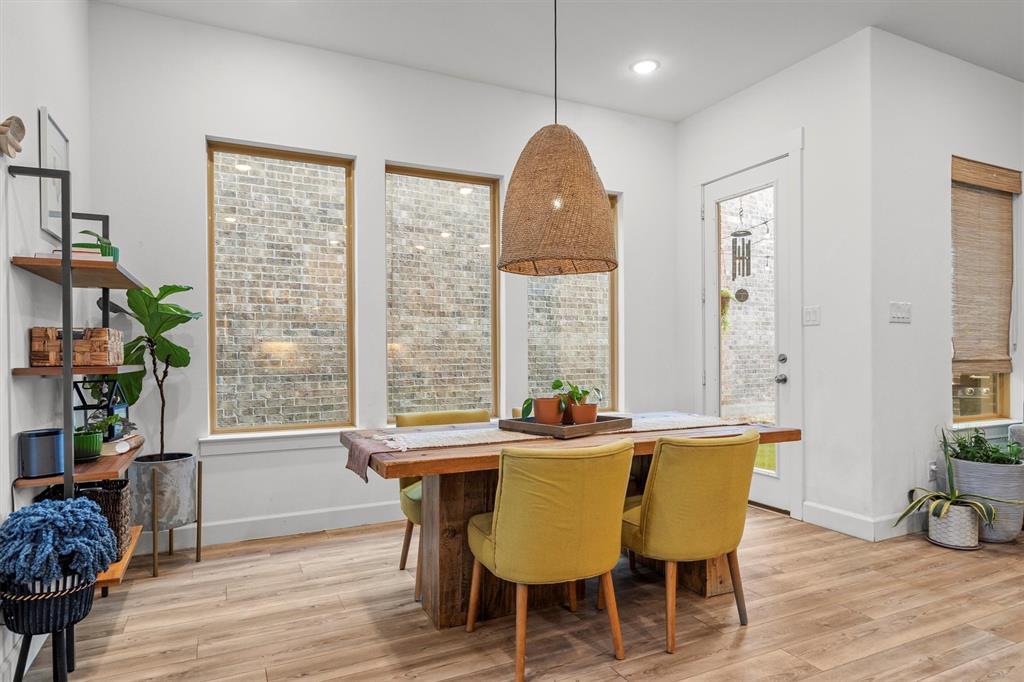 813 Forest Lake Road Flower Mound, TX 75028 - Photo 10 of 39 a view of a dining room with furniture window and wooden floor