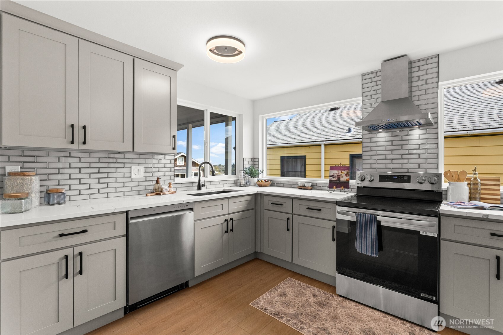 1811 South Stevens Street Seattle, WA 98144 - Photo 15 of 38 a kitchen with a sink stove and cabinets