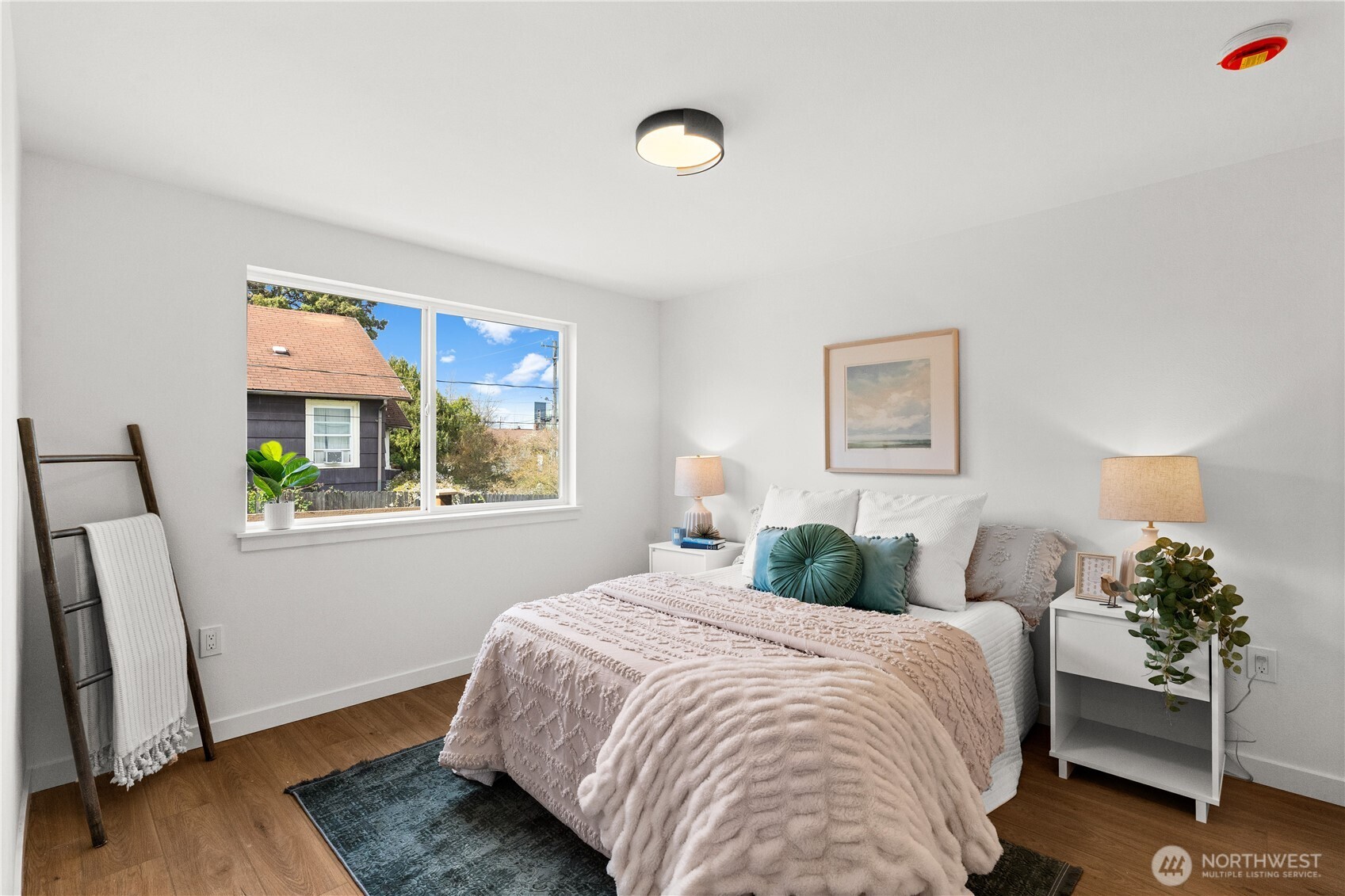 1811 South Stevens Street Seattle, WA 98144 - Photo 17 of 38 a bedroom with a bed and a window