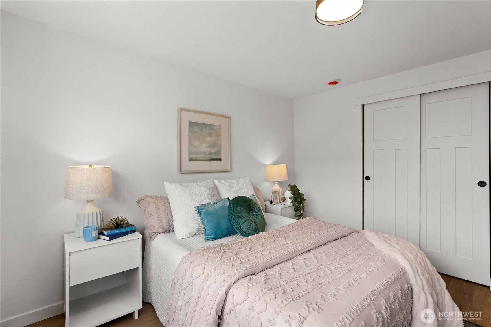 1811 South Stevens Street Seattle, WA 98144 - Photo 18 of 38 a bedroom with a bed and a lamp