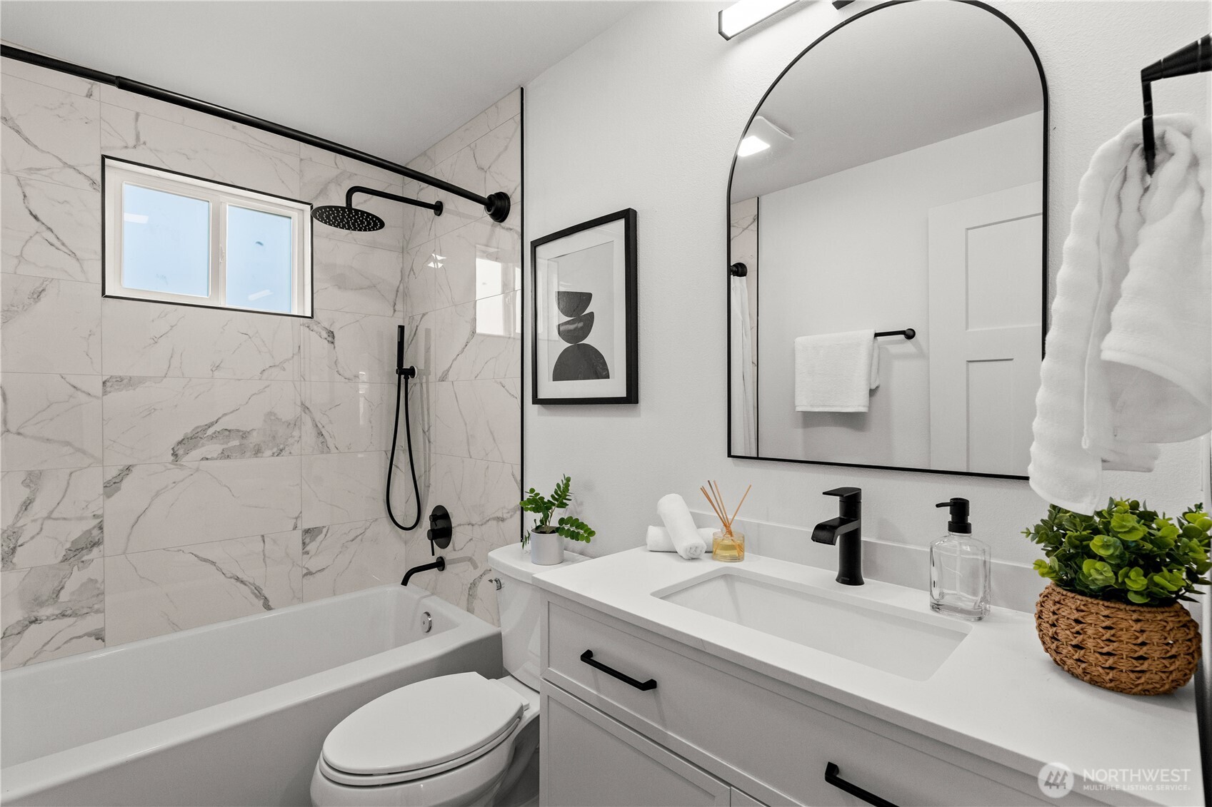 1811 South Stevens Street Seattle, WA 98144 - Photo 19 of 38 a bathroom with a sink a toilet a mirror a bathtub and shower