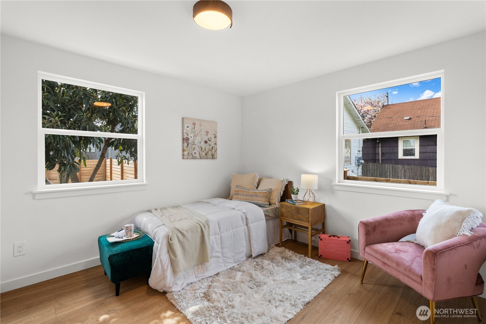 1811 South Stevens Street Seattle, WA 98144 - Photo 20 of 38 a bedroom with a bed and window