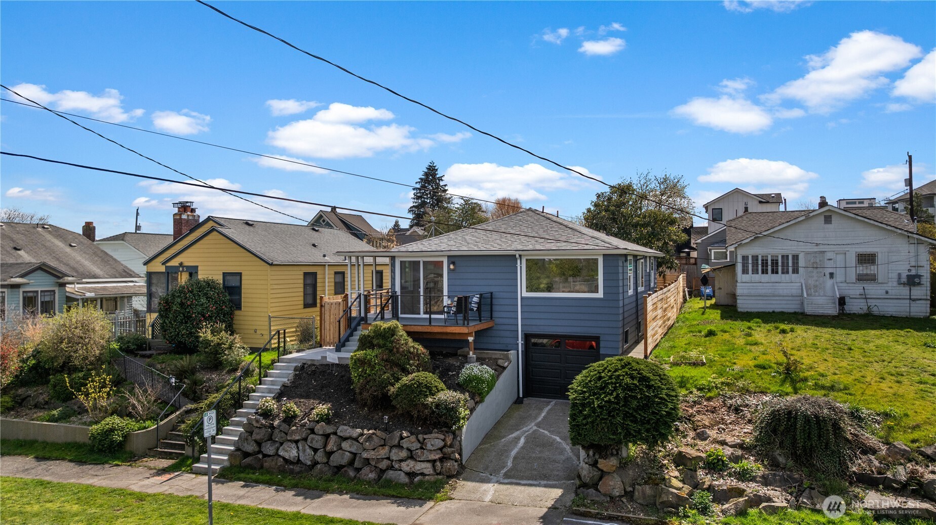 1811 South Stevens Street Seattle, WA 98144 - Photo 2 of 38 a front view of a house with a yard