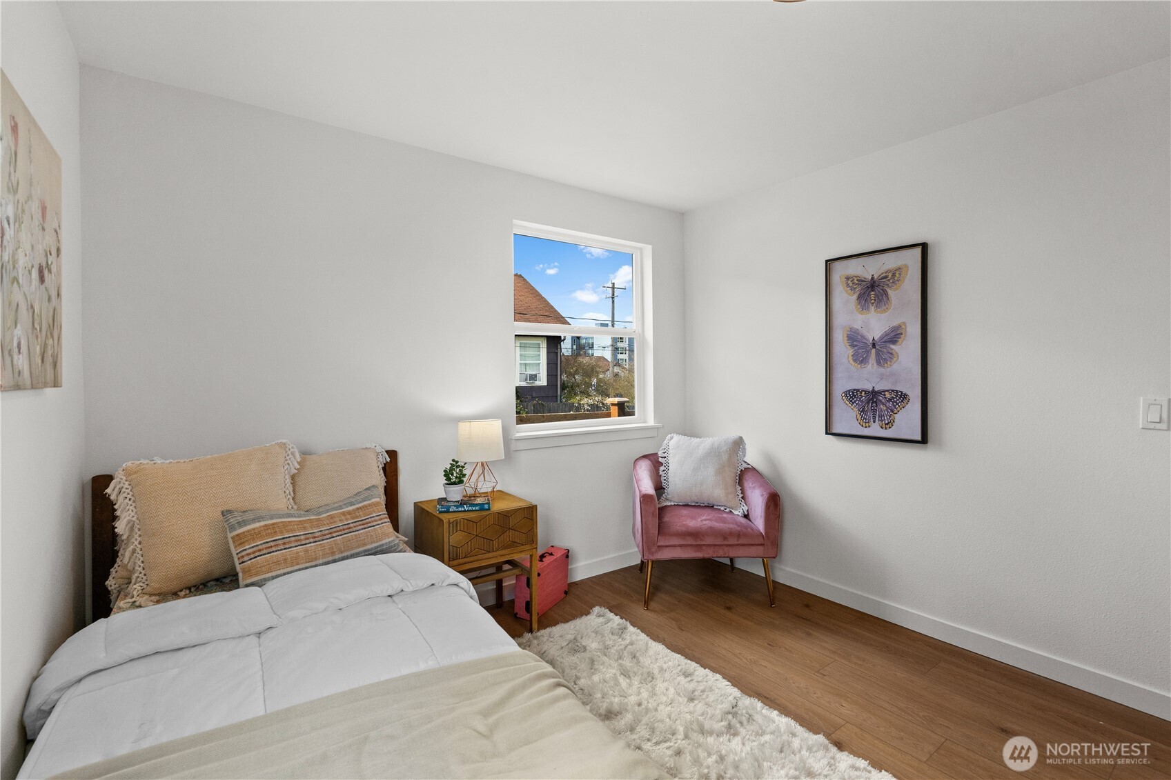 1811 South Stevens Street Seattle, WA 98144 - Photo 21 of 38 a bedroom with a bed and a window