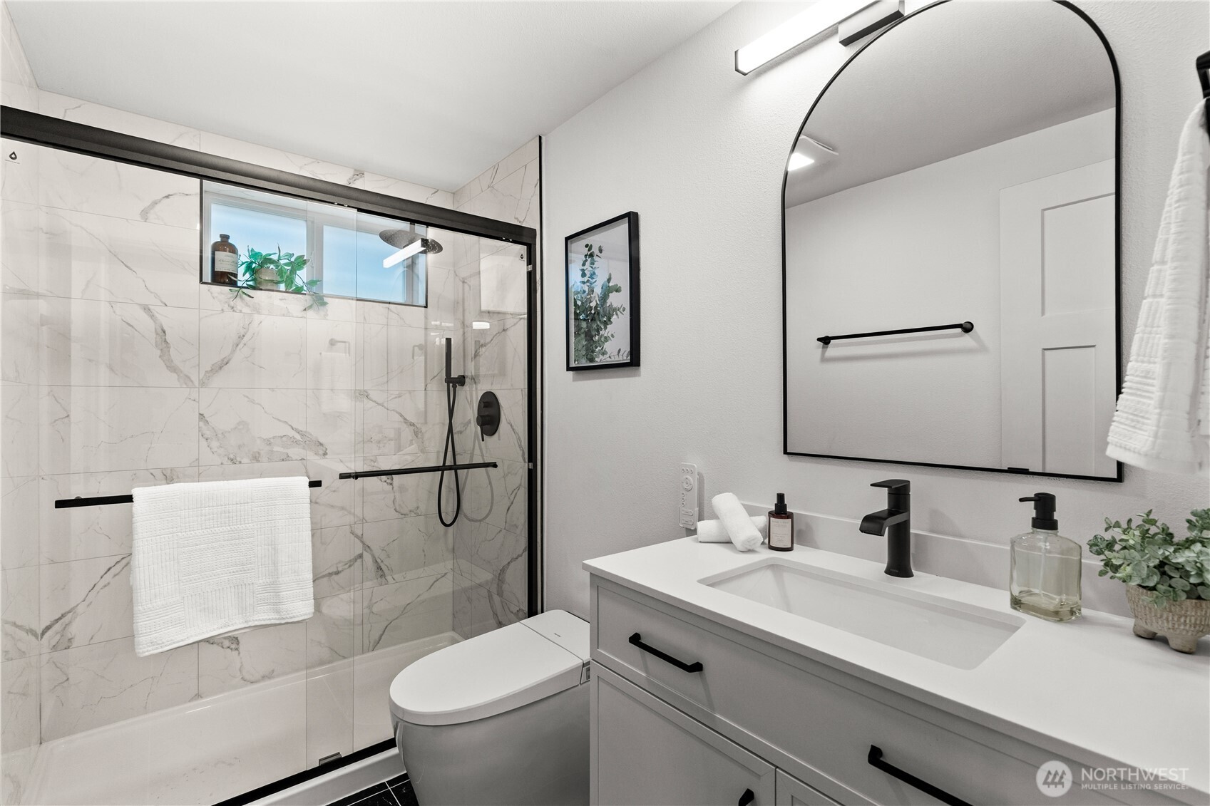 1811 South Stevens Street Seattle, WA 98144 - Photo 31 of 38 a bathroom with a sink a toilet and a mirror