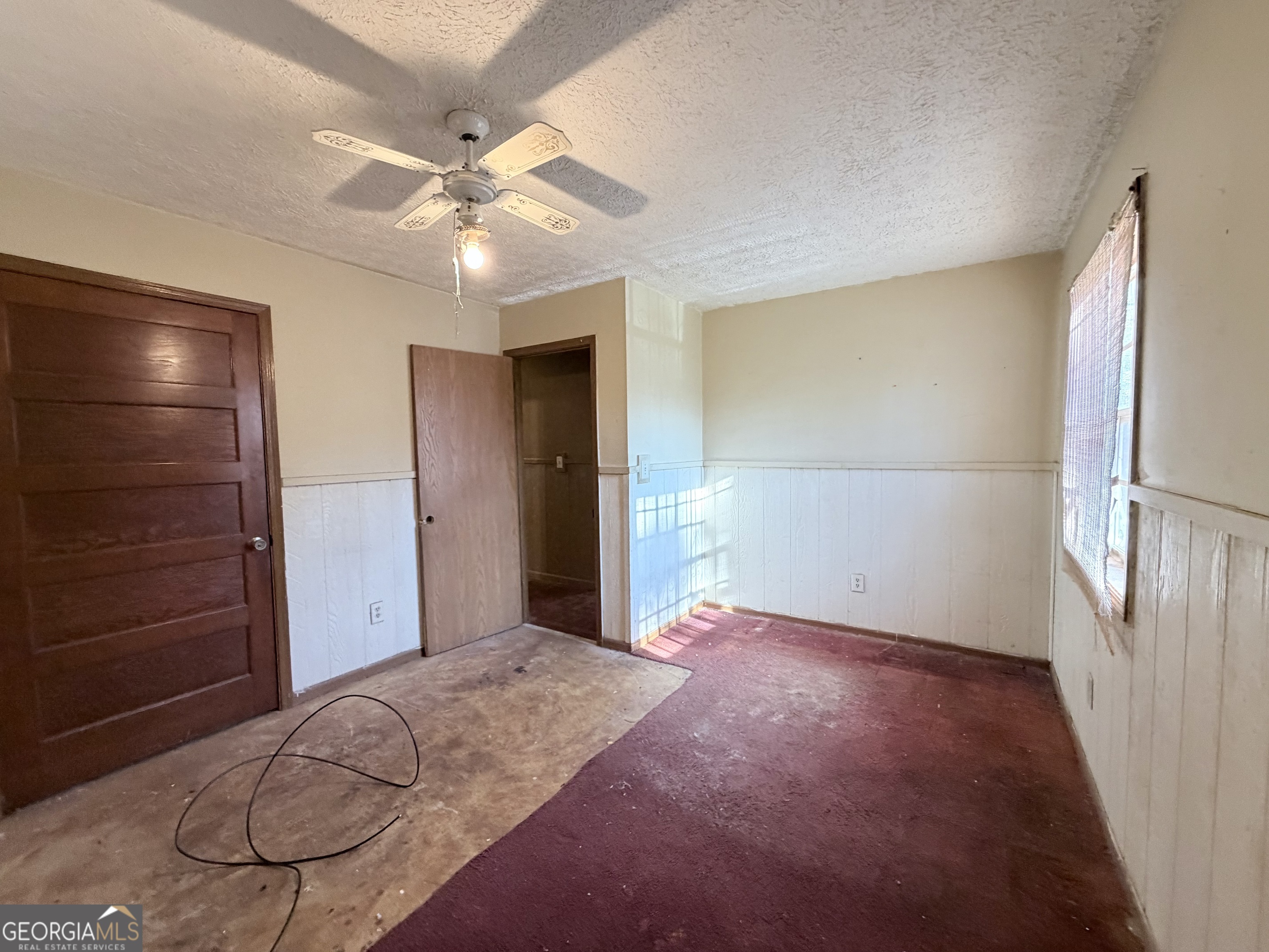 7118 Pineneedle Drive Southwest Covington, GA 30014 - Photo 11 of 17 a view of livingroom with hardwood floor and ceiling fan