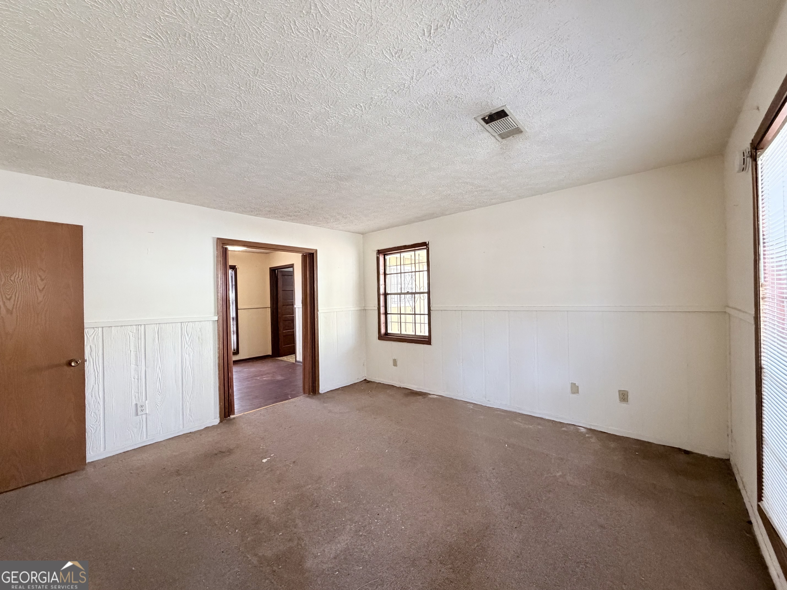 7118 Pineneedle Drive Southwest Covington, GA 30014 - Photo 3 of 17 a view of a room that has a window