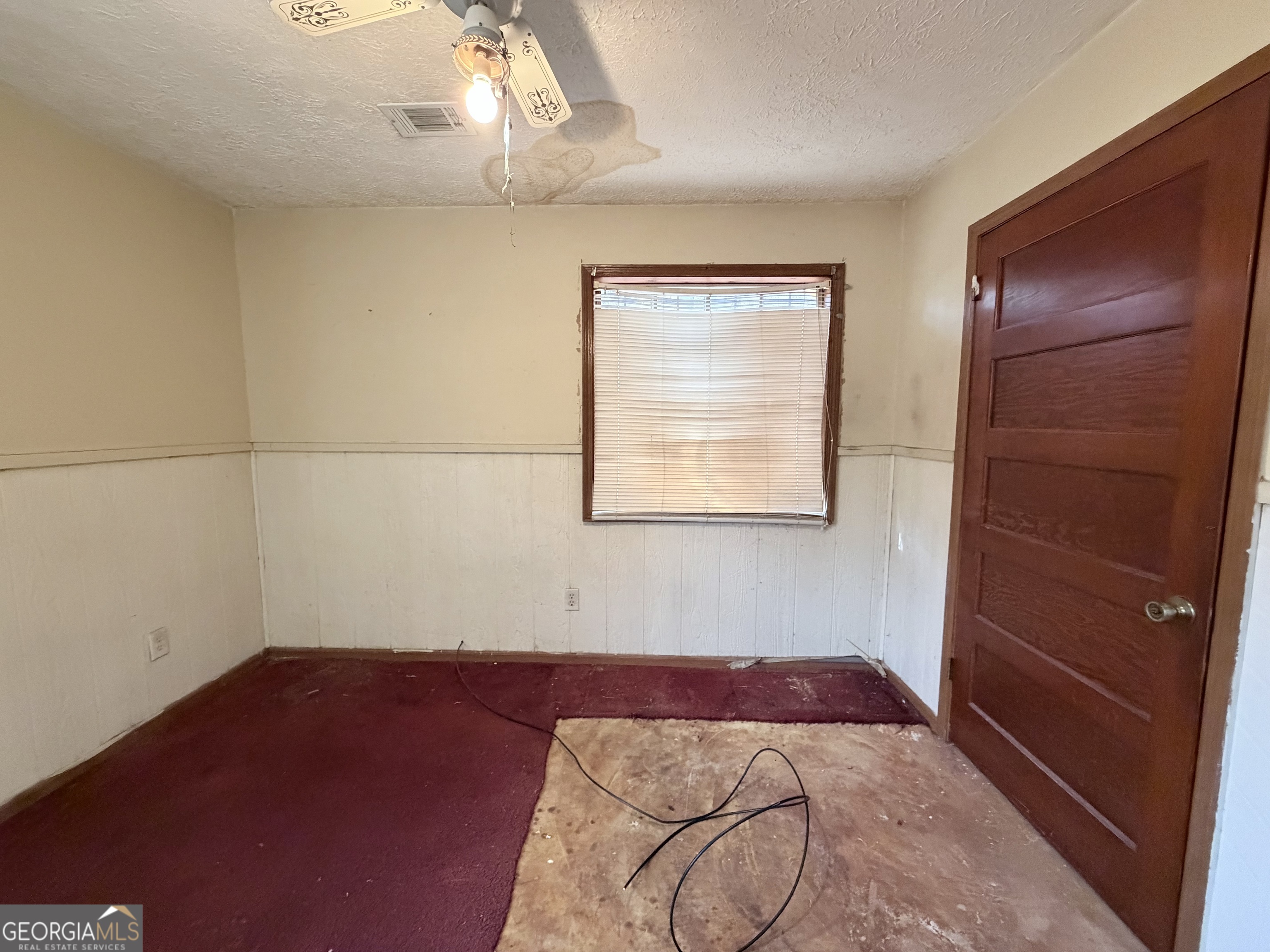 7118 Pineneedle Drive Southwest Covington, GA 30014 - Photo 10 of 17 a bedroom with a bed and a window