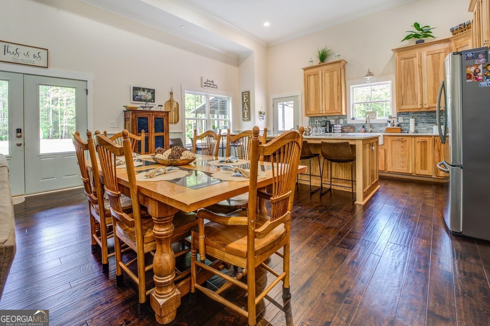 3060 Eatonton Road Madison, GA 30650 - Photo 13 of 65 a view of a dining room with furniture and wooden floor