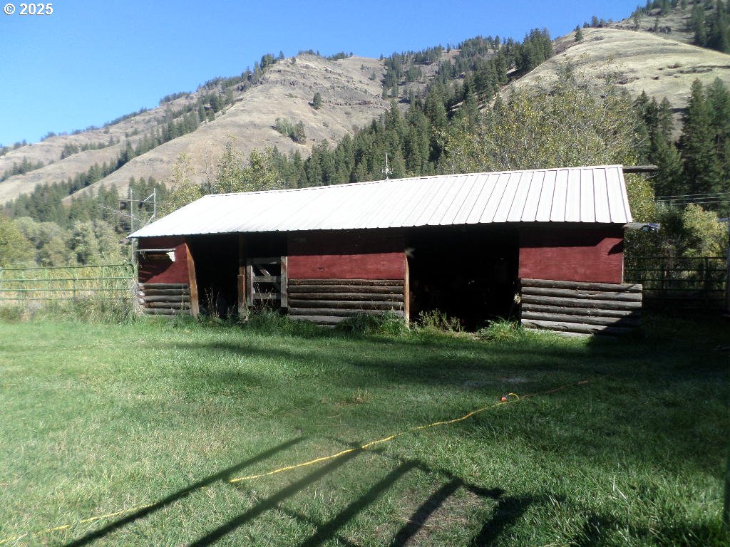 59075 Upper Imnaha Road Imnaha, OR 97842 - Photo 6 of 11 a view of a backyard with a garden