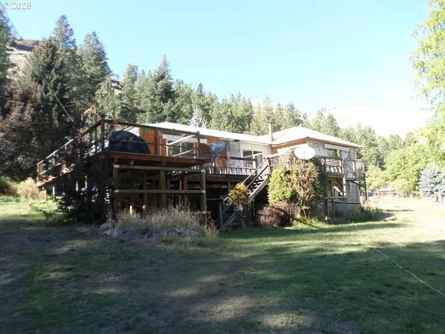 a view of a house with a yard porch and sitting area