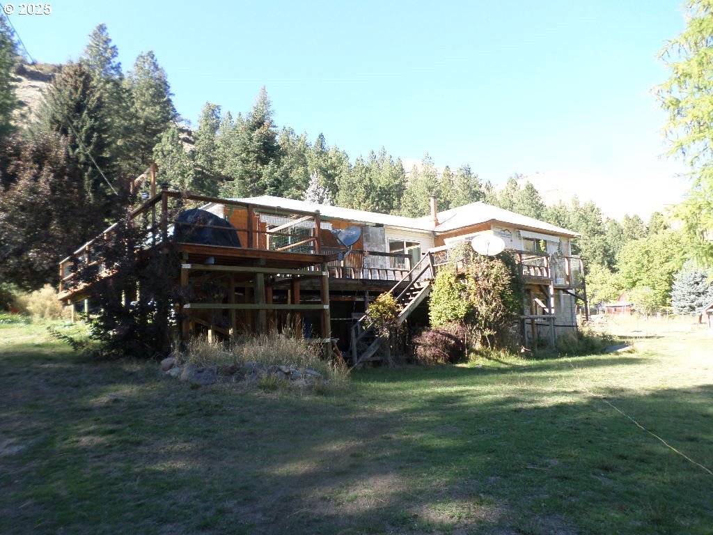 59075 Upper Imnaha Road Imnaha, OR 97842 - Photo 7 of 11 a view of a house with a yard porch and sitting area