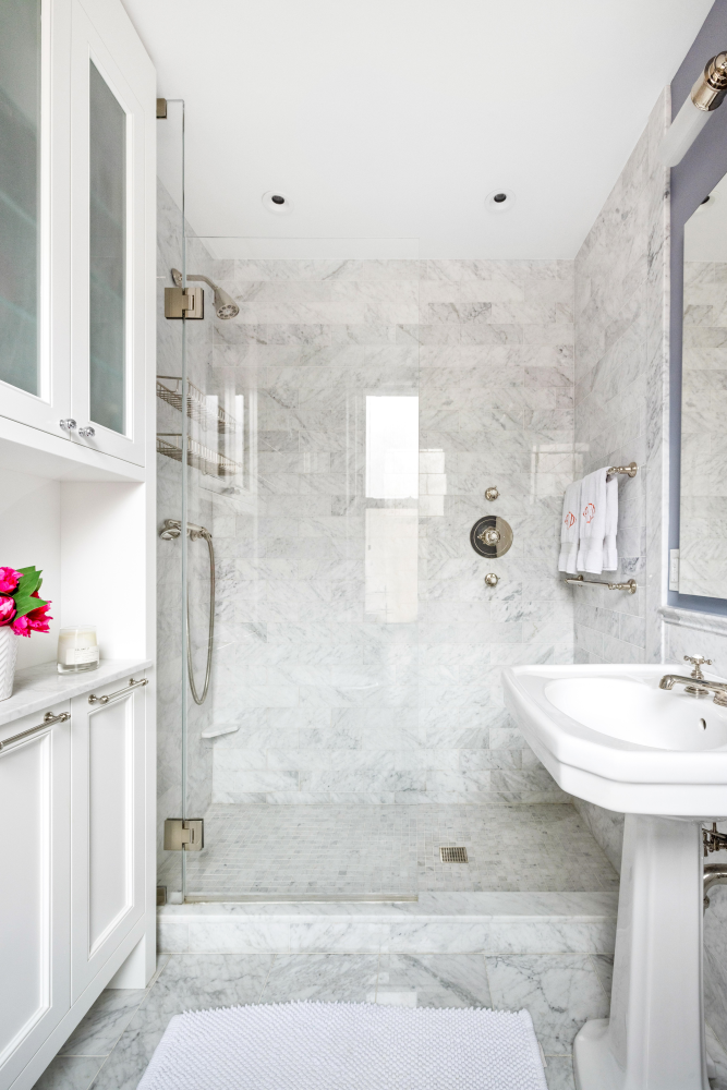 114 East 84th Street, Unit 8B Manhattan, NY 10028 - Photo 12 of 15 a bathroom with a sink shower and a mirror