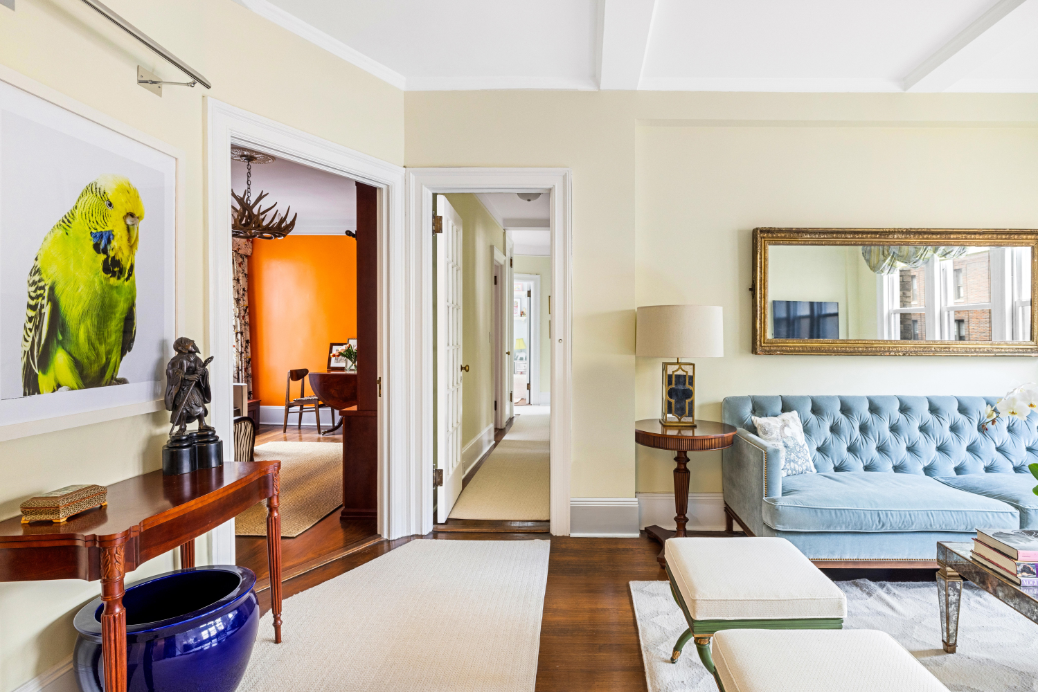 114 East 84th Street, Unit 8B Manhattan, NY 10028 - Photo 4 of 15 a living room with furniture and a lamp