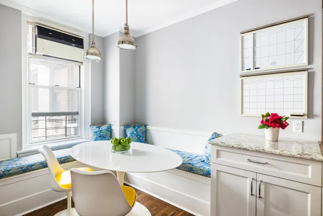 a living room with furniture and a lamp