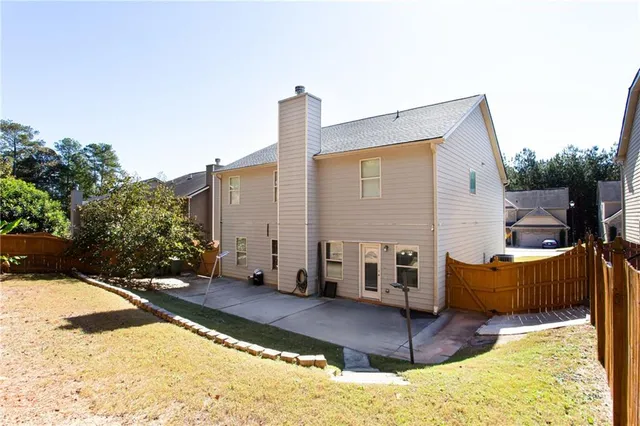 a balcony with table and chairs