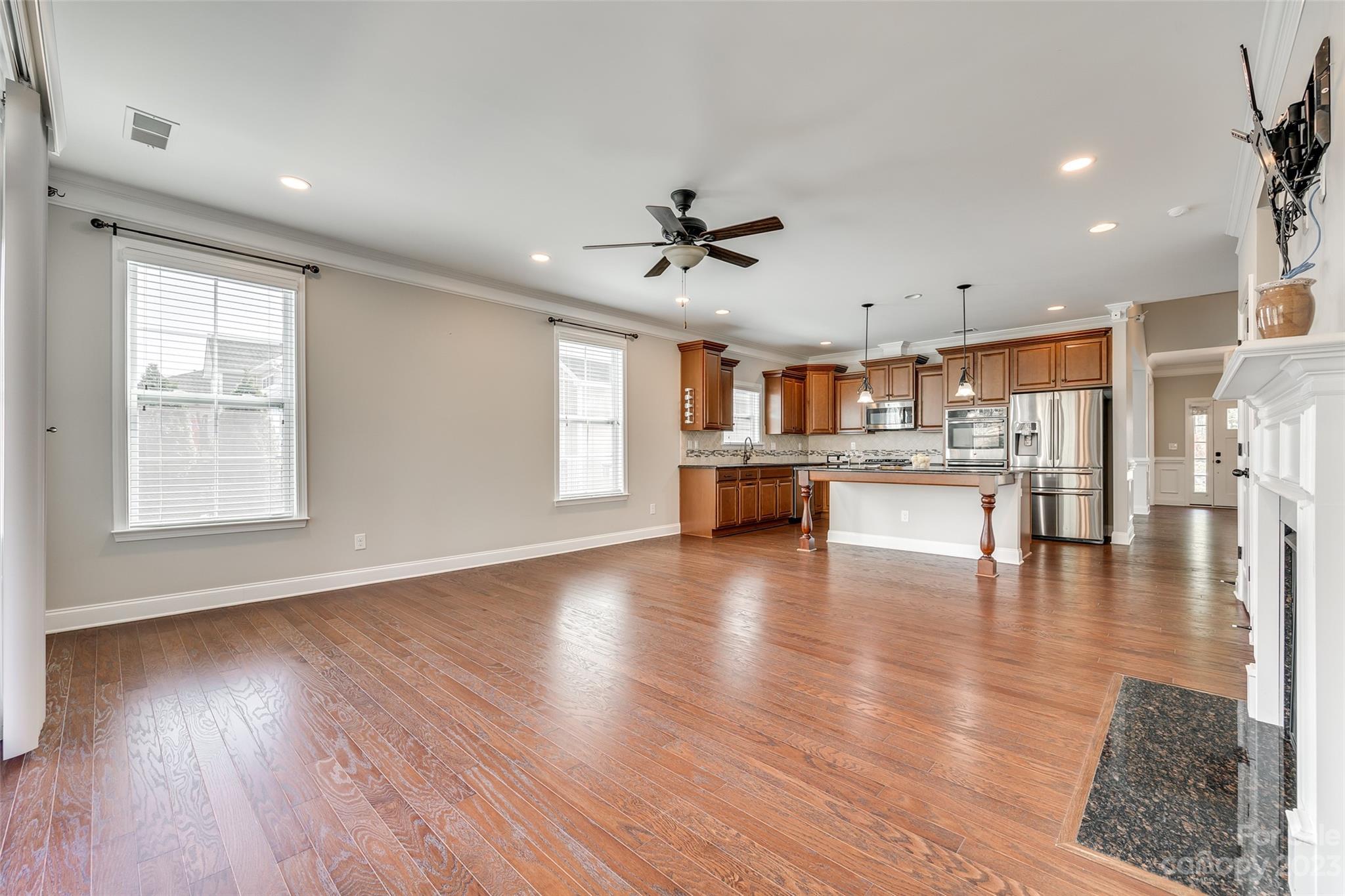 198 Annatto Way Tega Cay, SC 29708 - Photo 17 of 45 a view of kitchen with furniture and wooden floor