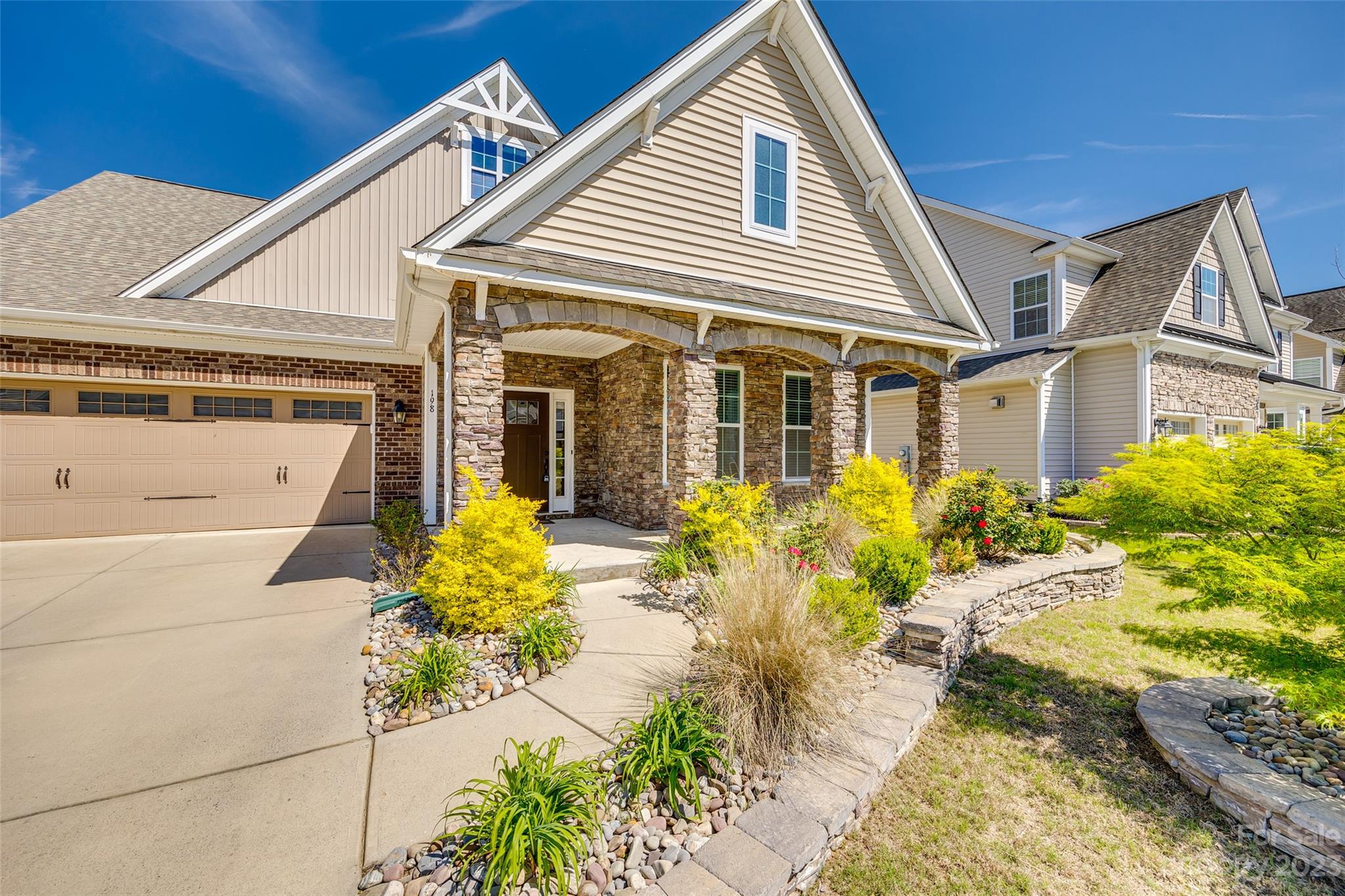 198 Annatto Way Tega Cay, SC 29708 - Photo 2 of 45 a front view of a house with a yard