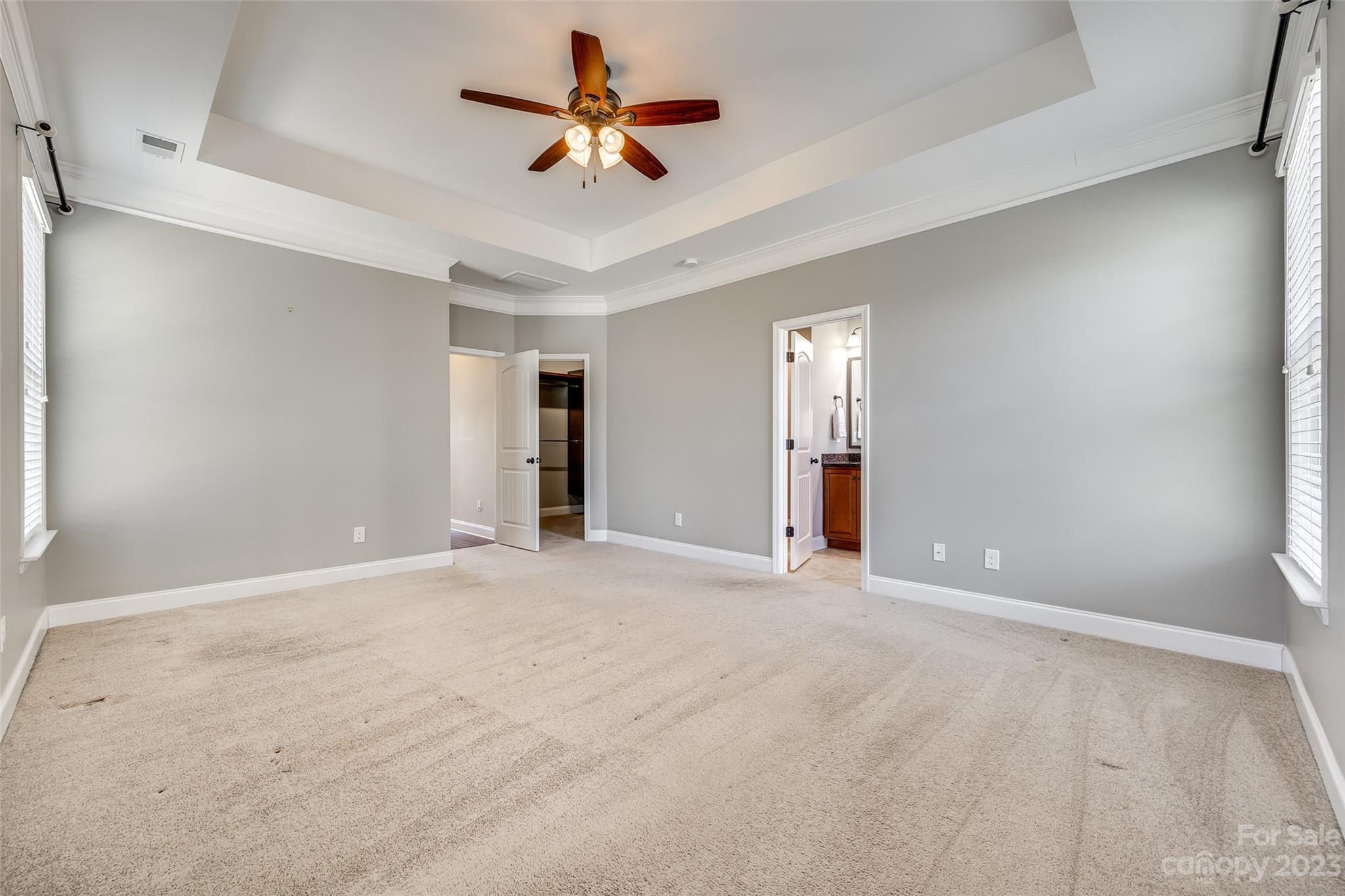 198 Annatto Way Tega Cay, SC 29708 - Photo 24 of 45 a view of an empty room with a ceiling fan and window