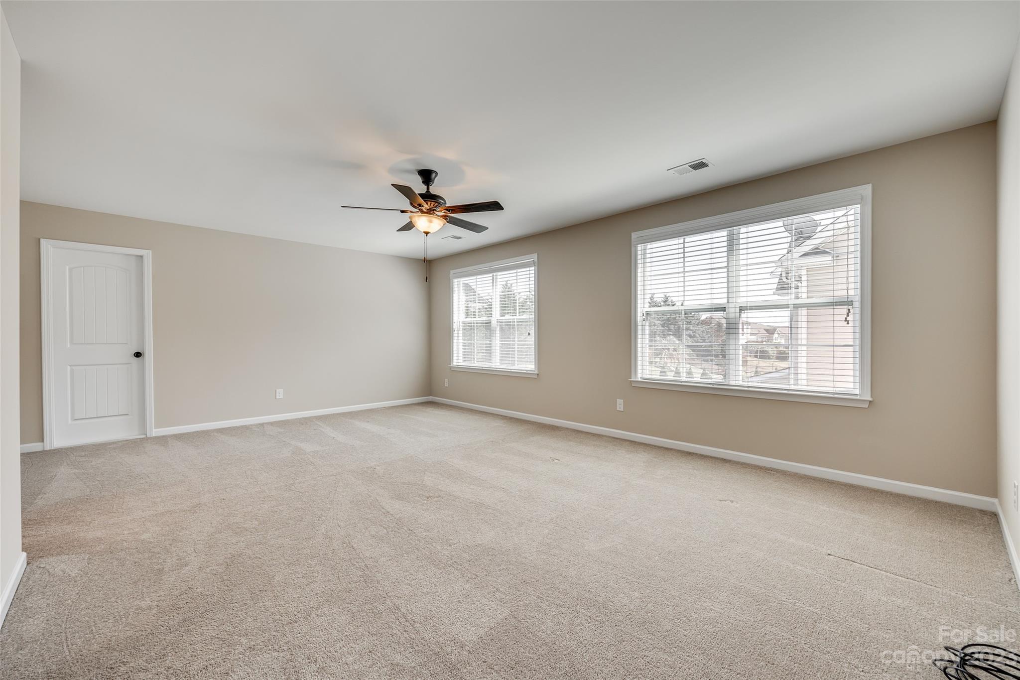 198 Annatto Way Tega Cay, SC 29708 - Photo 29 of 45 a view of an empty room with a window