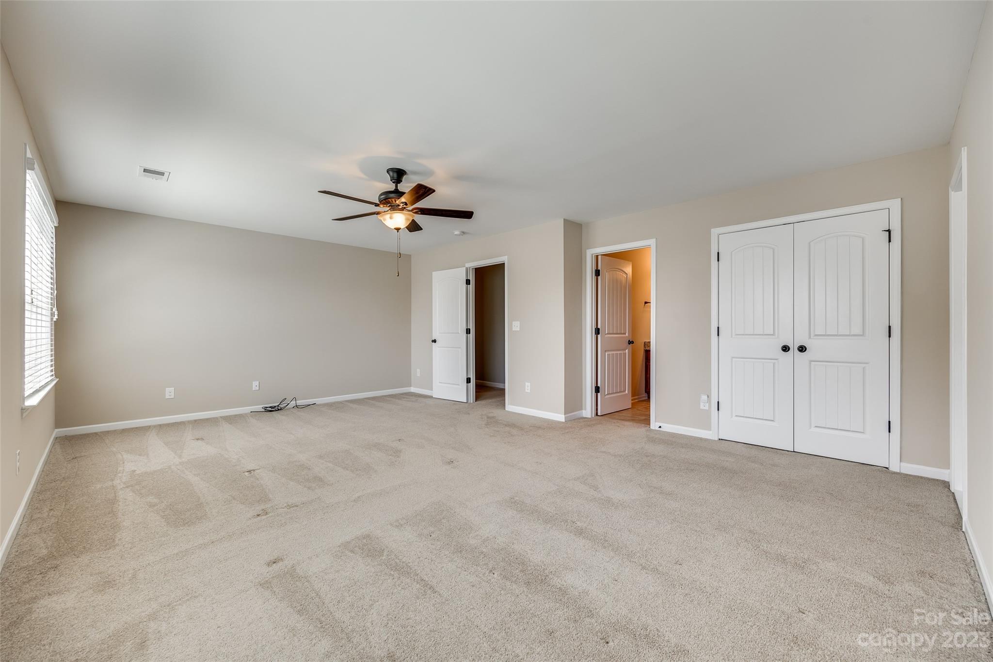 198 Annatto Way Tega Cay, SC 29708 - Photo 30 of 45 a view of an empty room with a window