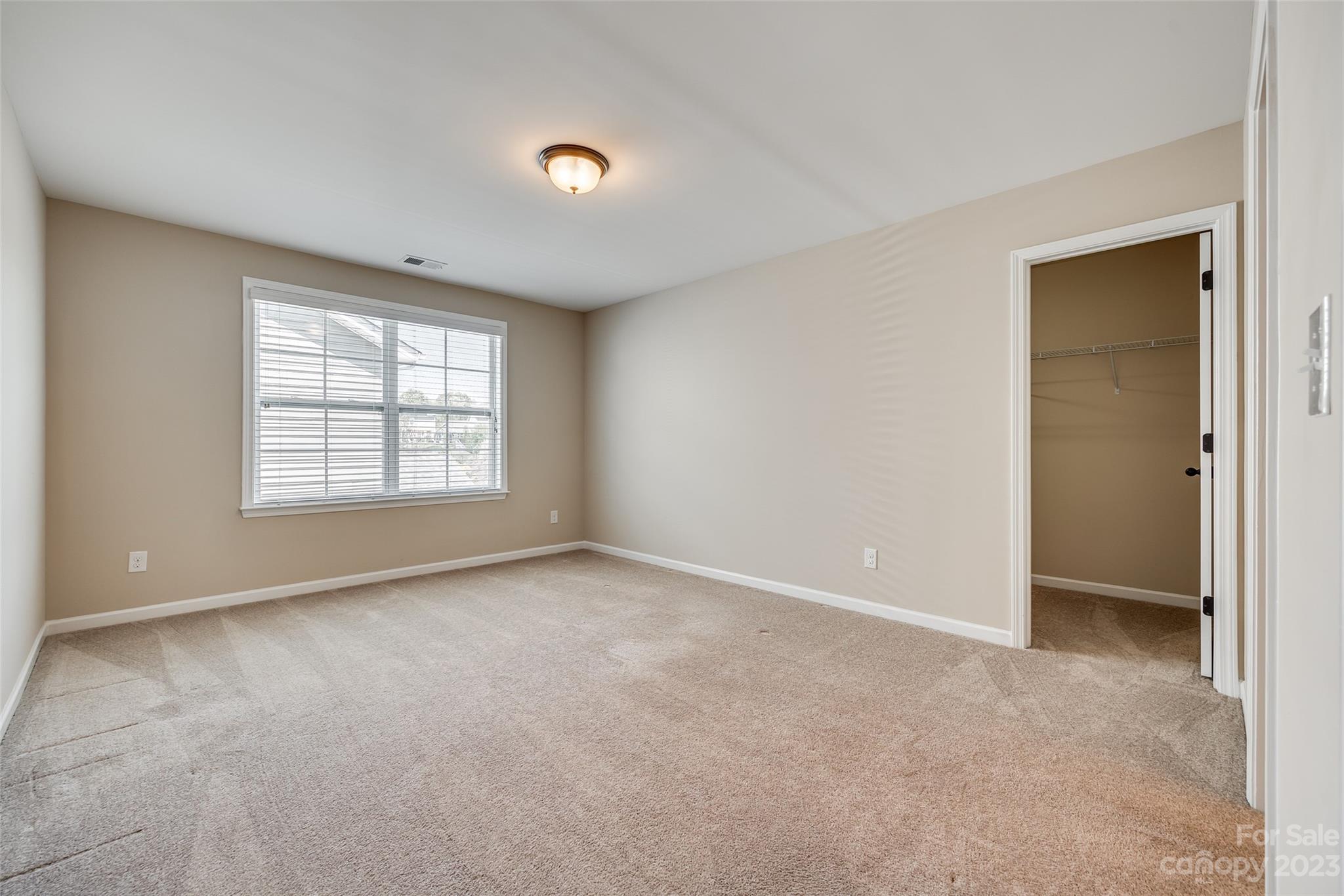 198 Annatto Way Tega Cay, SC 29708 - Photo 32 of 45 an empty room with windows and closet