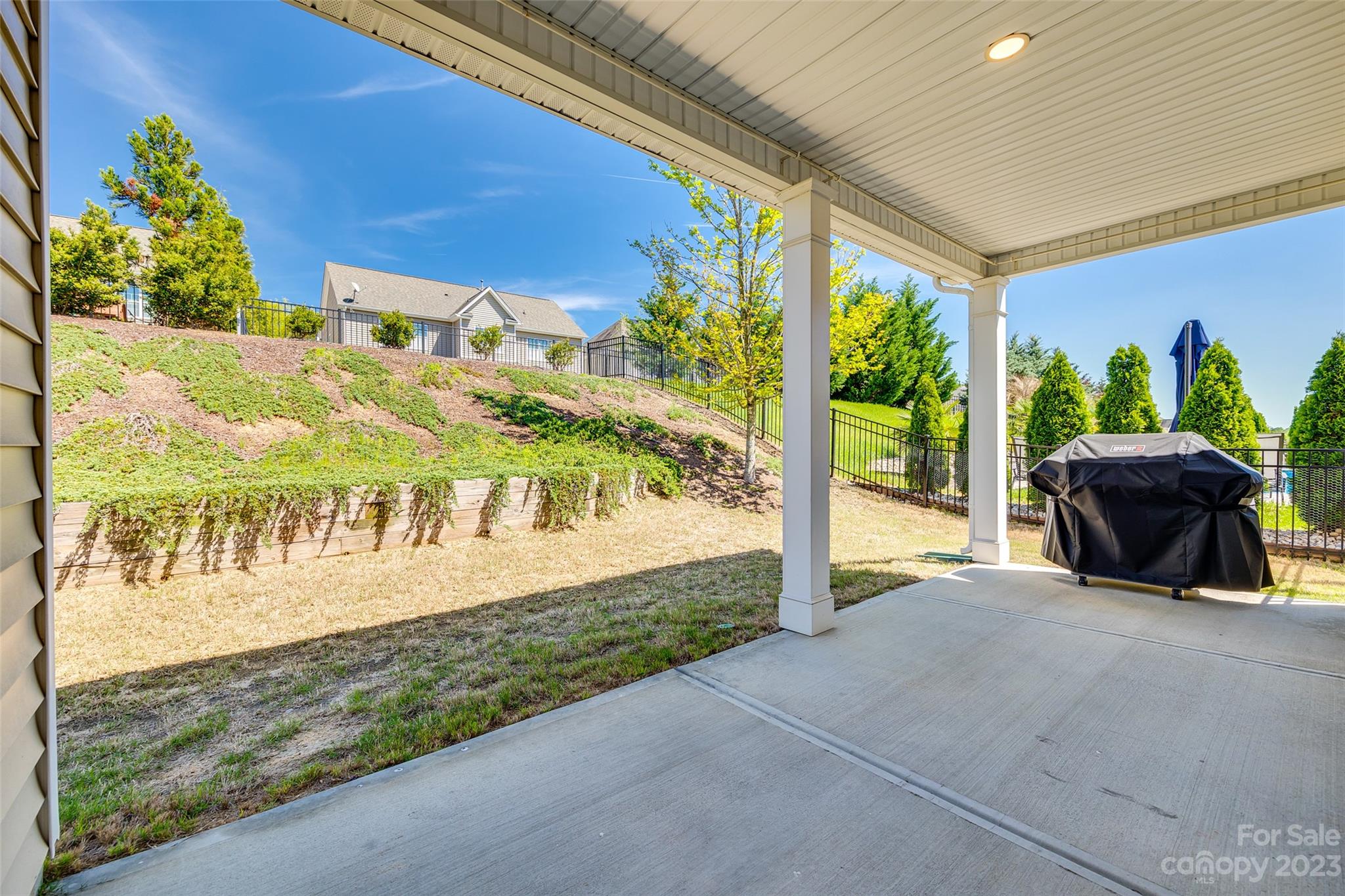 198 Annatto Way Tega Cay, SC 29708 - Photo 36 of 45 a view of a chairs and table in patio