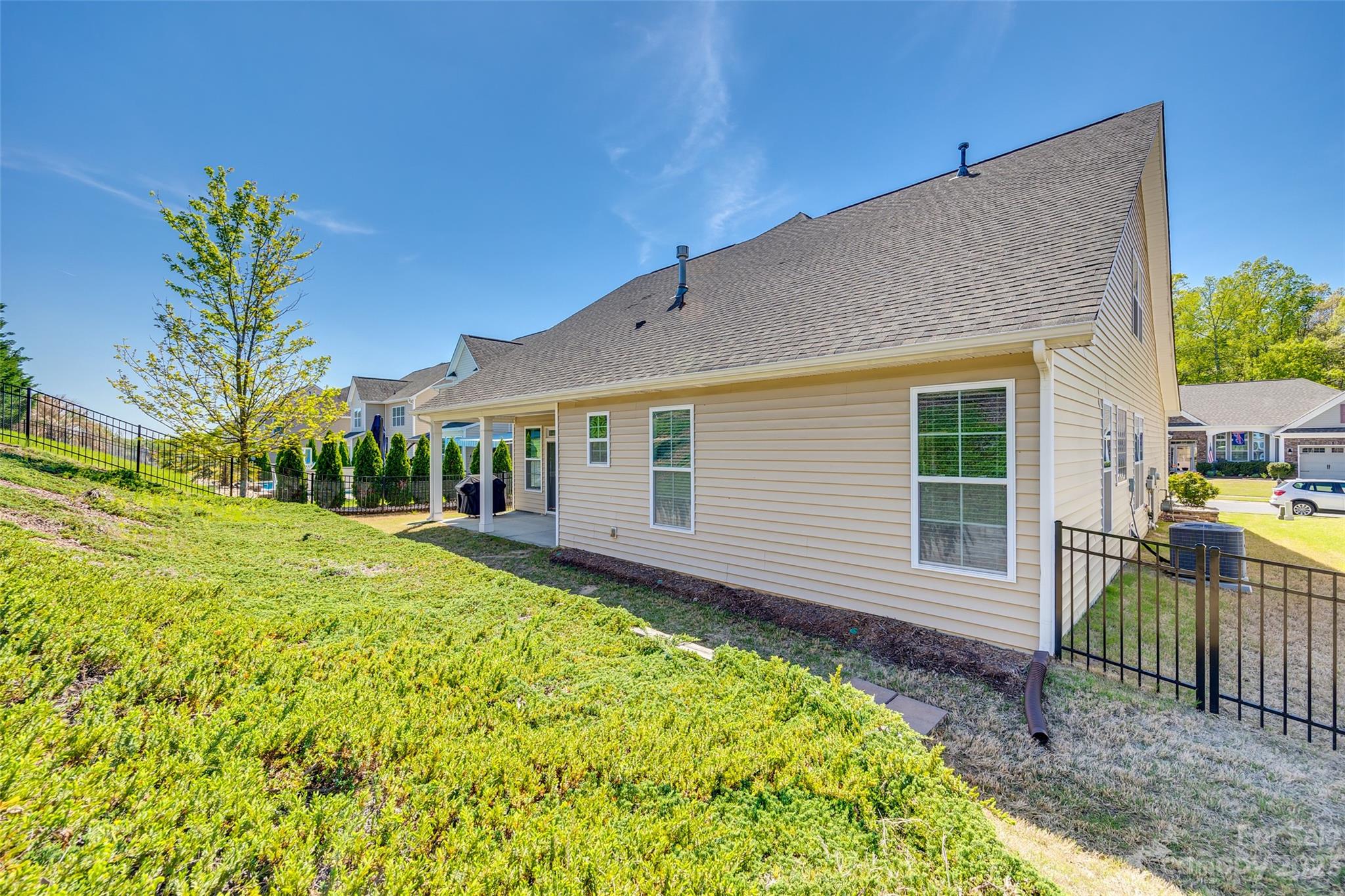 198 Annatto Way Tega Cay, SC 29708 - Photo 40 of 45 a view of a house with backyard and sitting area