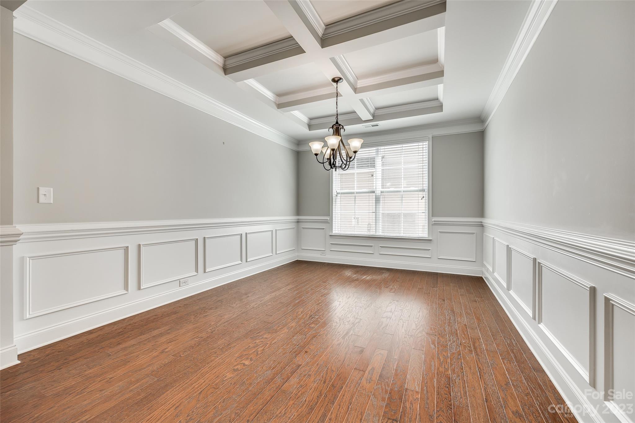198 Annatto Way Tega Cay, SC 29708 - Photo 8 of 45 wooden floor in an empty room with a window